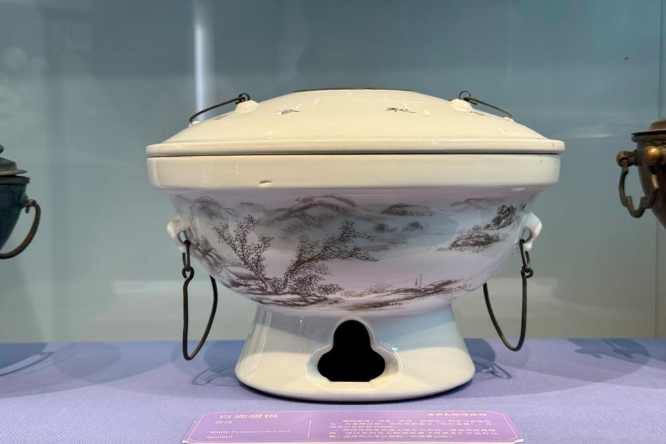Private guide at Suzhou Folk Custom Museum white porcelain warm pot exhibit