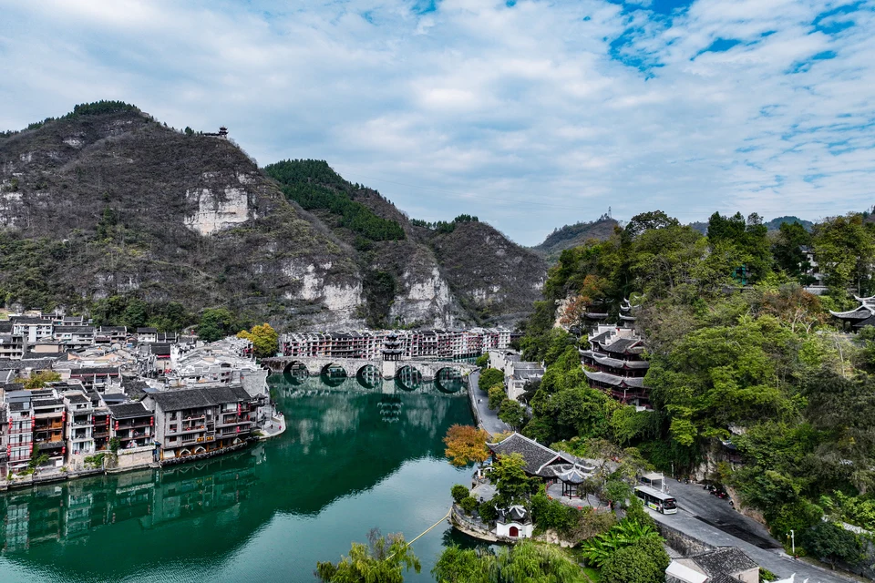 Private guide exploring Zhenyuan Ancient Town riverside view