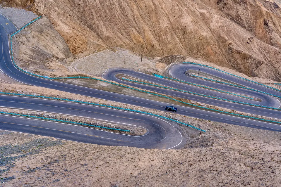 Panlong Ancient Road winding through Pamir Plateau mountains in Xinjiang