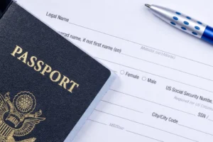 Passport placed on a visa application form with a pen, representing China visa application and travel preparation