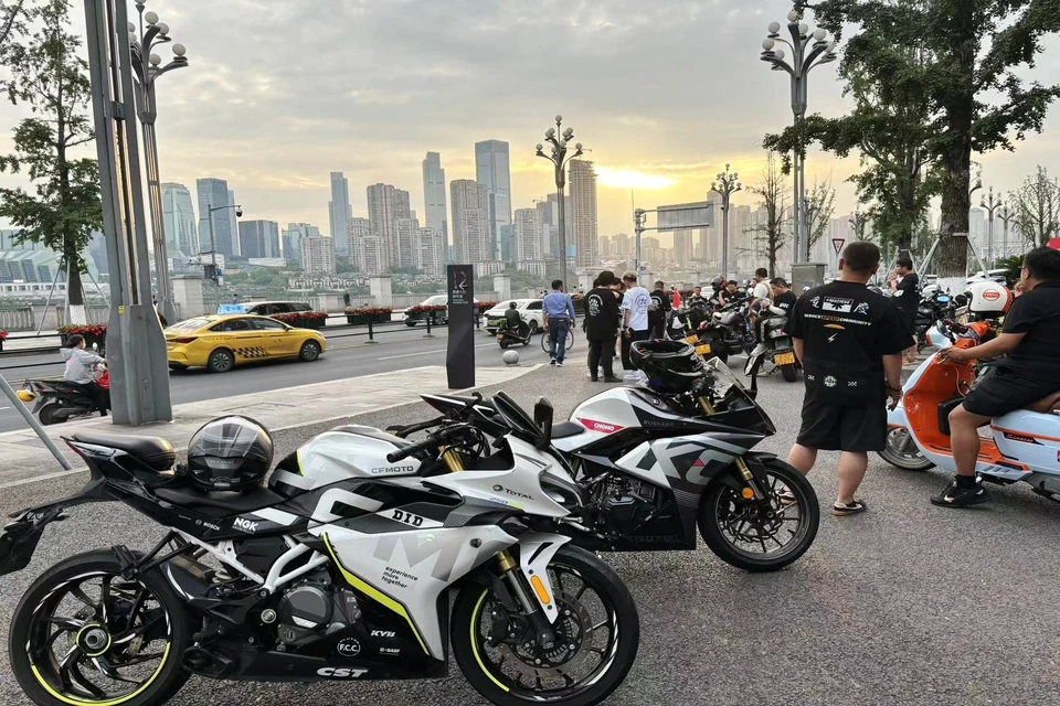 Private tour night motorcycle ride in Chongqing with illuminated bridges, riverside roads, and skyline views