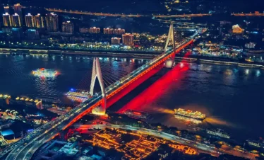 Private tour hero image of Chongqing night skyline with Hongyadong, rivers, bridges, and layered mountain city buildings