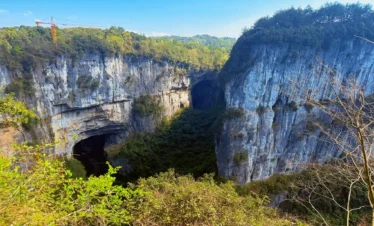 Private tour hero image of Wulong Three Natural Bridges in Chongqing with dramatic karst arches and canyon scenery