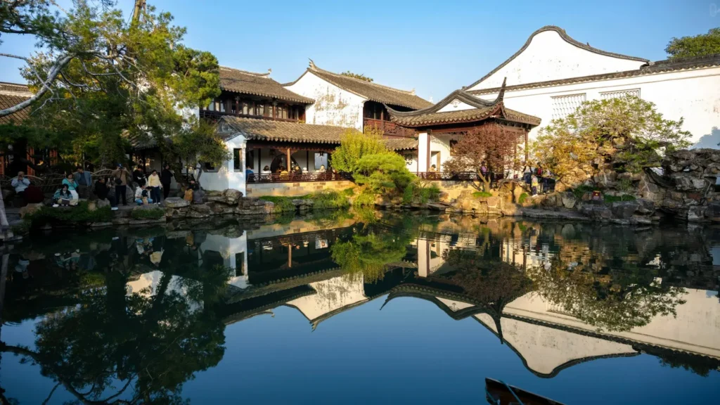 Classic East China travel scene combining gardens, lakes, and historic city heritage.