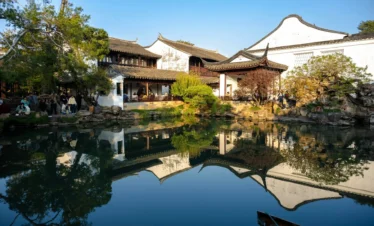 Classic East China travel scene combining gardens, lakes, and historic city heritage.