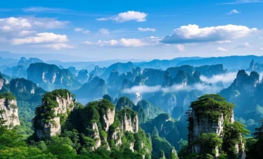 Avatar-inspired sandstone peaks in Zhangjiajie rising through clouds and mist.